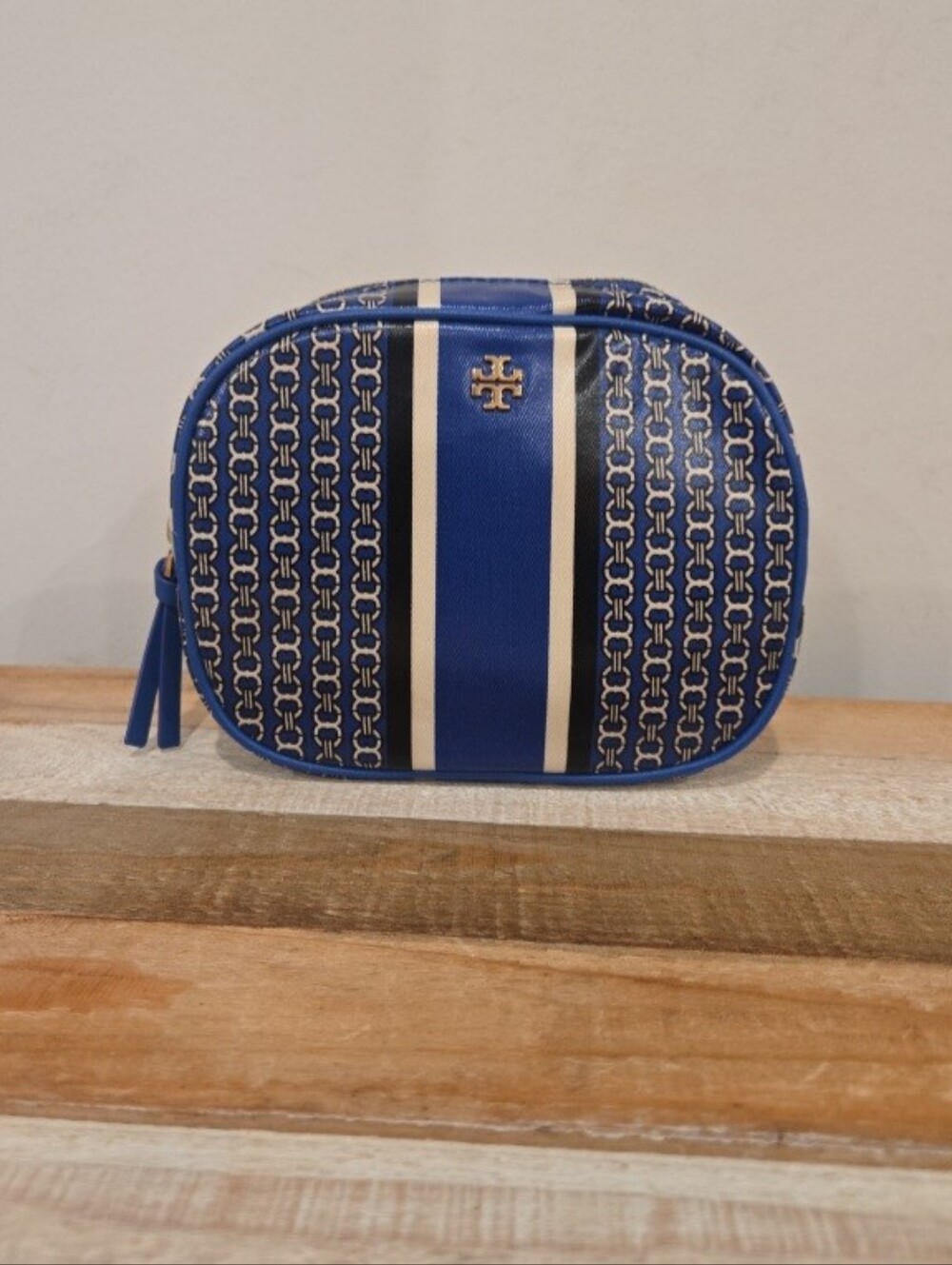 Tory Burch Gemini Link Stripe Makeup Bag With Vertical Striped Design.